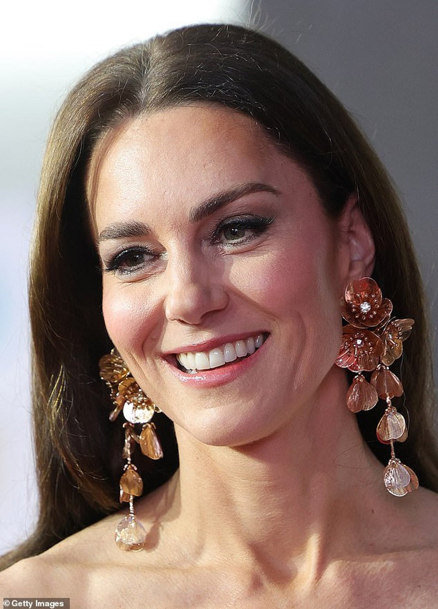 Floral cascading earrings and necklace set in gold and silver.