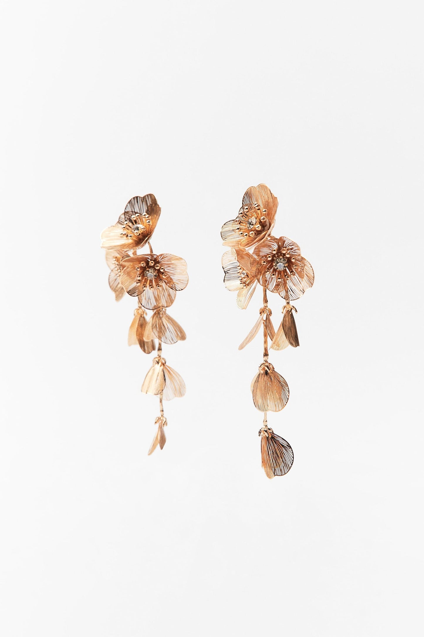 Floral cascading earrings and necklace set in gold and silver.