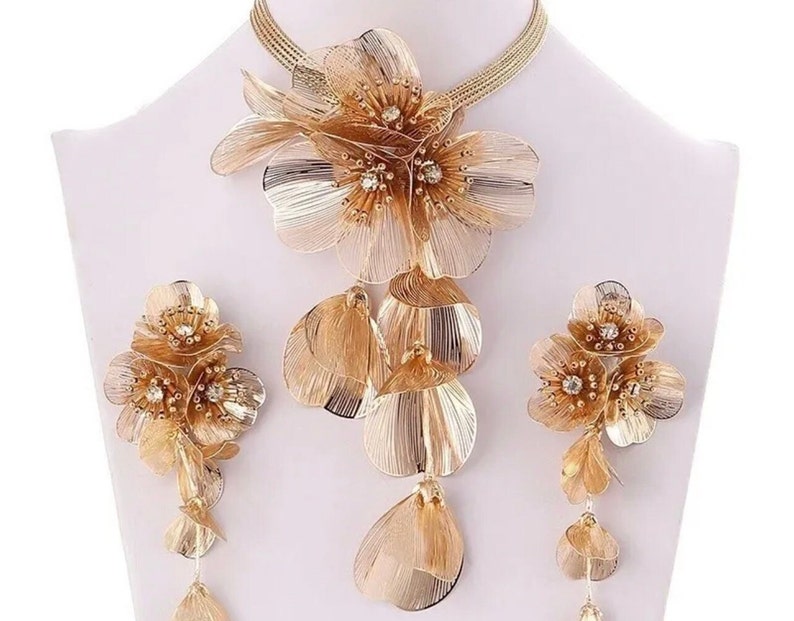 Floral cascading earrings and necklace set in gold and silver.