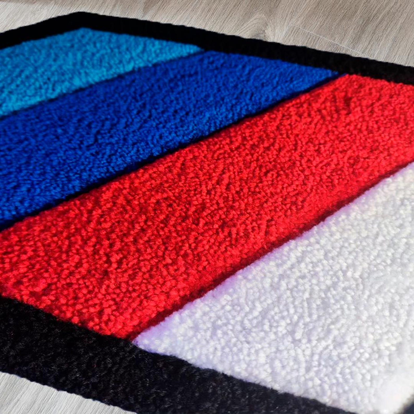 BMW racing car rug in a stylish garage setting