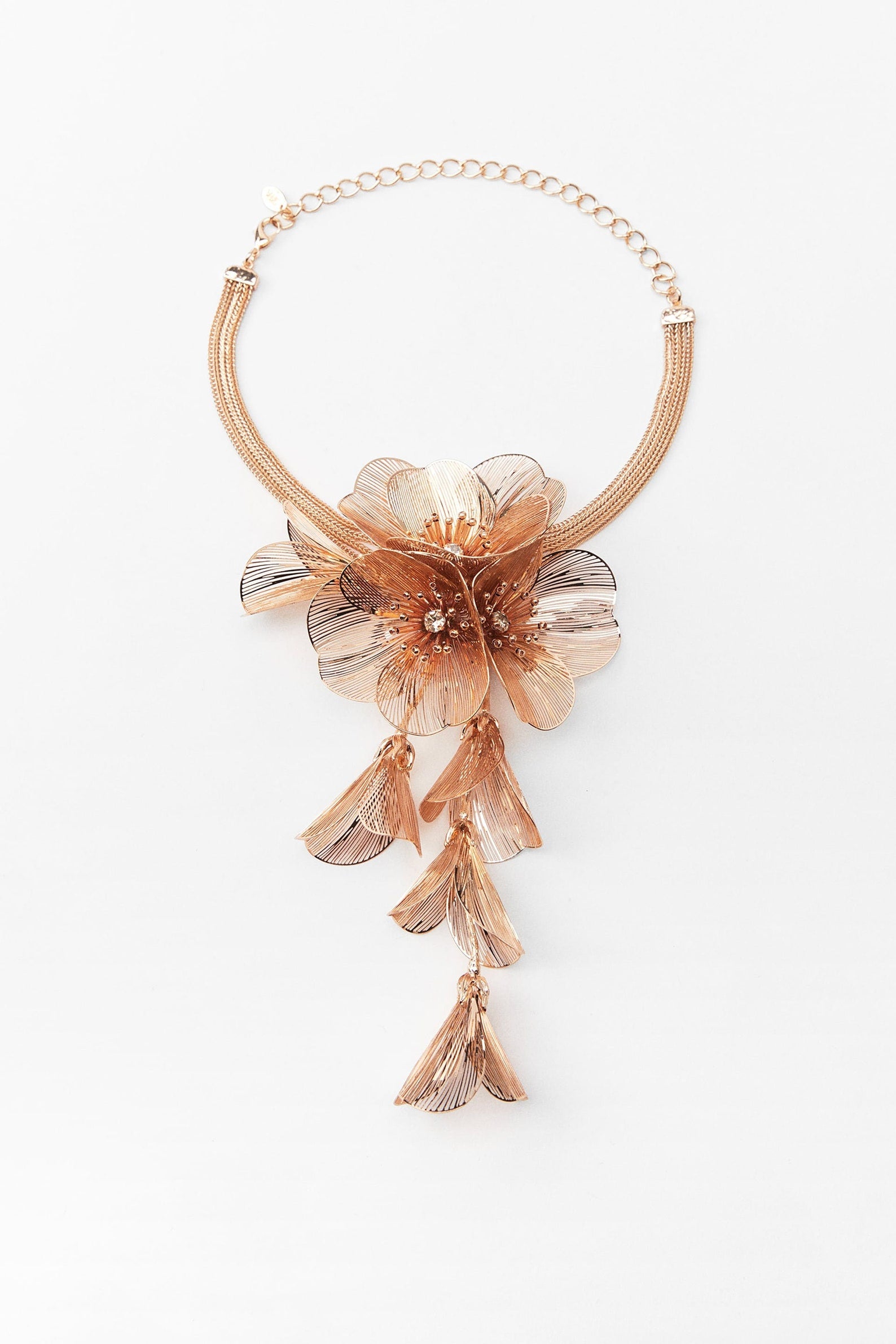 Floral cascading earrings and necklace set in gold and silver.